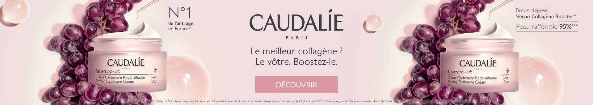 2 pots de Caudalie resveratrol-lift ouvert avec une grappe de raison rouge